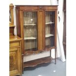 Large Edwardian inlaid mahogany display cabinet with serpentine front and curved glass, two