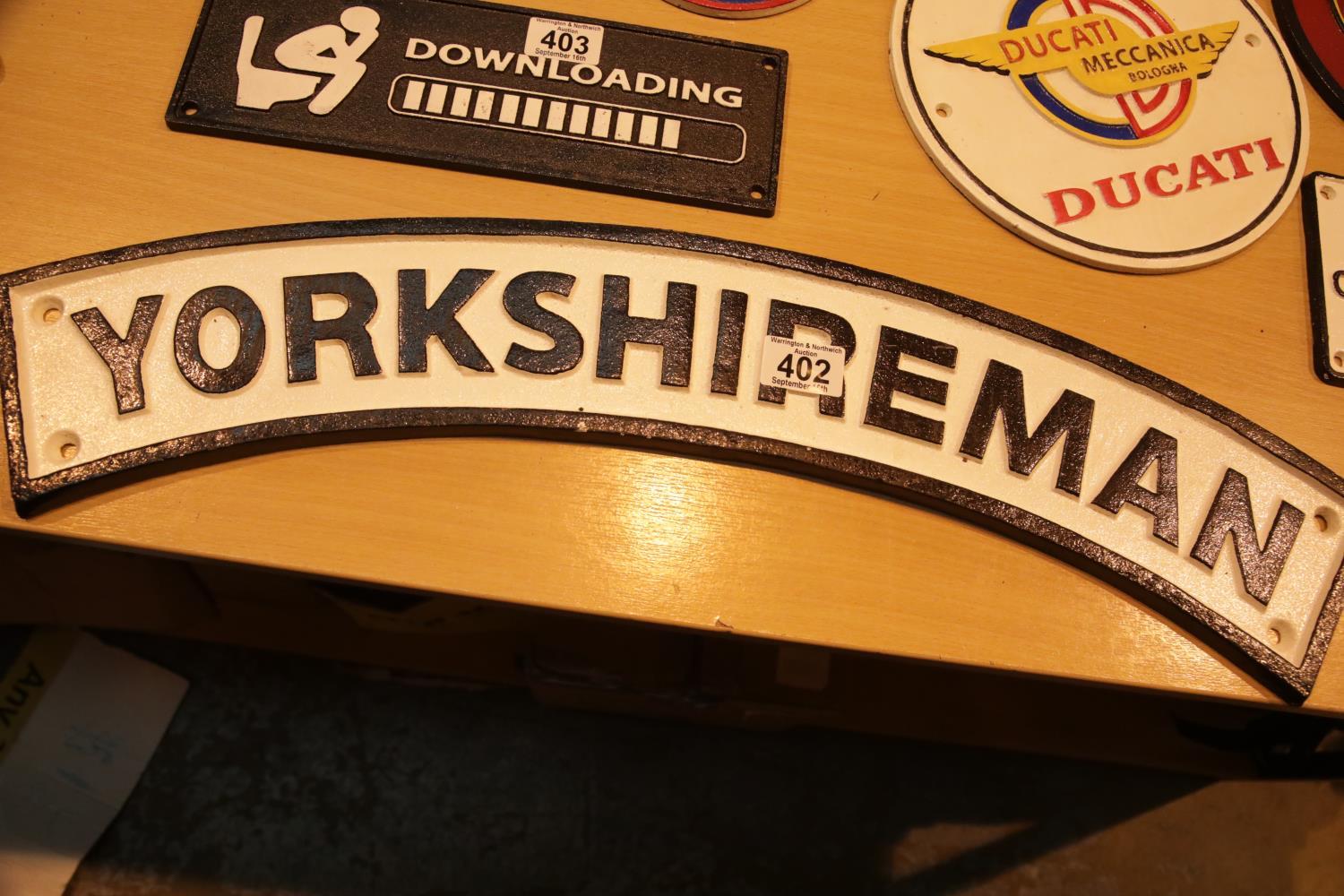 Cast iron Yorkshireman sign, L: 60 cm. P&P Group 2 (£18+VAT for the first lot and £3+VAT for