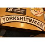 Cast iron Yorkshireman sign, L: 60 cm. P&P Group 2 (£18+VAT for the first lot and £3+VAT for