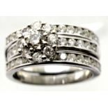 Combined wedding and engagement rings with three rows of diamonds in 18ct white gold. Central