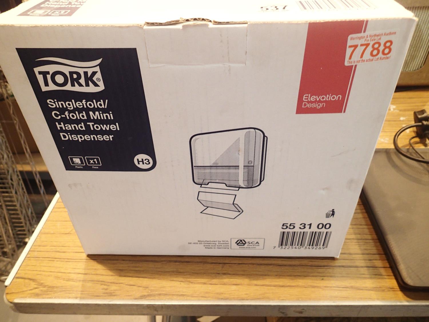 Boxed Tork singlefold/C fold mini hand towel dispenser as new. P&P Group 2 (£18+VAT for the first