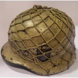 German WWII type helmet with soft netting, no chin strap but original shell and liner. Net and