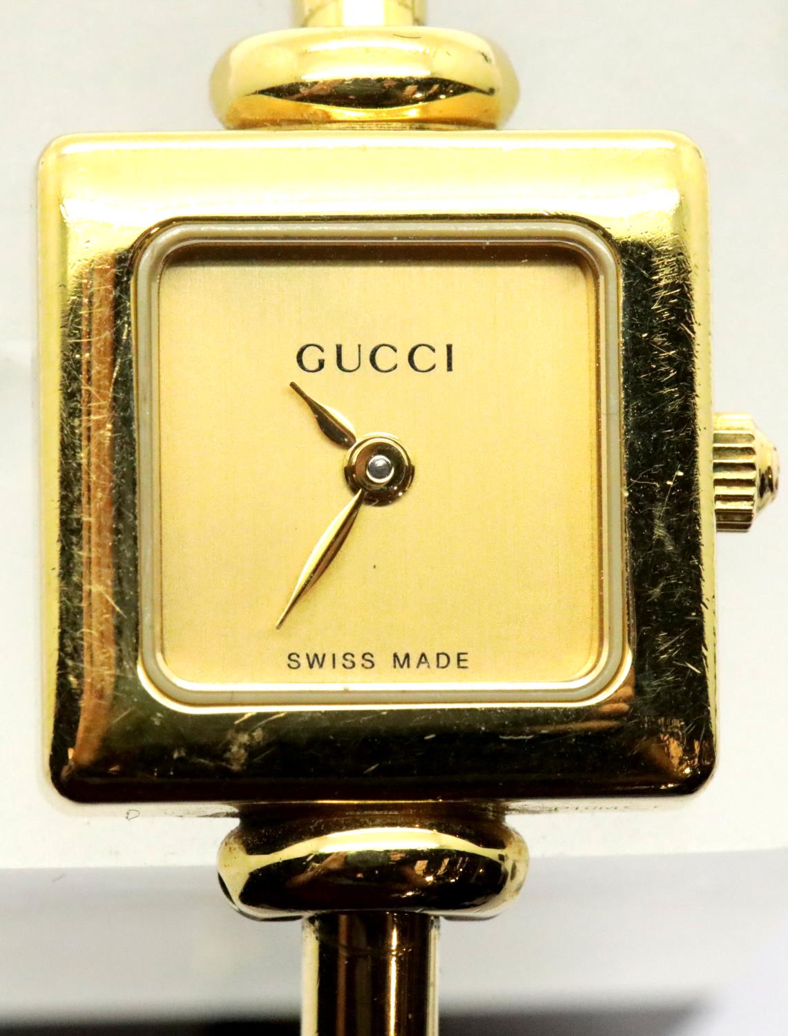 Ladies gold plated Gucci cocktail watch with champagne dial. P&P Group 1 (£14+VAT for the first
