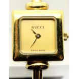 Ladies gold plated Gucci cocktail watch with champagne dial. P&P Group 1 (£14+VAT for the first