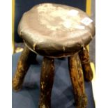 Antique leather top six legged milking stool. P&P Group 3 (£25+VAT for the first lot and £5+VAT