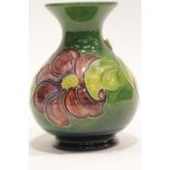 Moorcroft green ground bulbous vase. P&P Group 2 (£18+VAT for the first lot and £3+VAT for