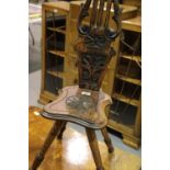 Early 19thC lyre back spinning chair with carved seat, H: 90 cm. Not available for in-house P&P.
