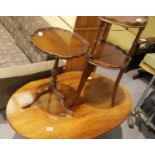 Contemporary mahogany oval coffee table, a reproduction mahogany lamp table and a two tier plant