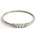 Sterling silver CZ set snap bangle, D: 6.5 cm, 14g. P&P Group 1 (£14+VAT for the first lot and £1+