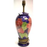 Large Moorcroft blue ground lamp base in the Hibiscus pattern, H: 32 cm. P&P Group 3 (£25+VAT for