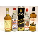 Boxed Johnnie Walker black label 75cl, 1L of Bells whisky, two bottles of vodka and a 1L bottle of