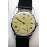 Boxed Gents Omega vintage champagne dial wristwatch on a leather strap. P&P Group 1 (£14+VAT for the