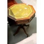 Octagonal mahogany lamp table set with two drawers and tooled leather insert, H: 60 cm. Not