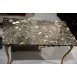 Gilt cast metal coffee table, Rococo design with claw and ball supports, having a rectangular