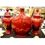 Large Sang De Boeuf ceramic moon flask in red glaze, H: 61 cm, with a pair of large temple urns,