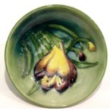 Moorcroft blue ground small bowl in the Crocus pattern, D: 11 cm. P&P Group 1 (£14+VAT for the first