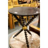 Victorian ebonised and gilt circular gypsy table on tripod bobbin supports, H: 65 cm. Not