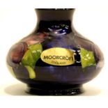 Moorcroft blue ground bulbous vase in the Pansy pattern, H: 7 cm. P&P Group 1 (£14+VAT for the first