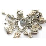 Silver charm bracelet with eleven charms, 92g. P&P Group 1 (£14+VAT for the first lot and £1+VAT for
