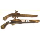 Two brass mounted flintlock pistol in poor condition. P&P Group 2 (£18+VAT for the first lot and £