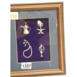 Framed display of Middle-Eastern presumed silver miniatures. P&P Group 1 (£14+VAT for the first