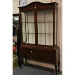 Large Edwardian inlaid mahogany cabinet, the glazed display top with glass shelves sits on a chest