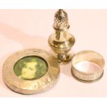 Hallmarked silver napkin ring, photo frame and pepperette. P&P Group 1 (£14+VAT for the first lot