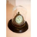 Pocket watch in glass dome with leather base. P&P Group 2 (£18+VAT for the first lot and £3+VAT