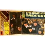 Two Beatles LPs, The Greatest on Odeon label, Please Please Me on yellow Parlophone label and