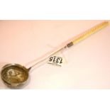 George II / III white metal brandy ladle, the repousse bowl inset with a George II silver shilling