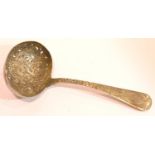 Decorative hallmarked silver sifting spoon. P&P Group 1 (£14+VAT for the first lot and £1+VAT for