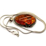 Sterling silver necklace with a large Baltic Amber pendant. P&P Group 1 (£14+VAT for the first lot