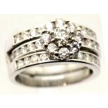 Combined wedding and engagement rings with three rows of diamonds in 18ct white gold. Central