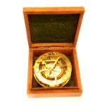 Hardwood cased brass compass marked West London. P&P Group 2 (£18+VAT for the first lot and £3+VAT