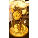 Vintage brass anniversary clock with glass dome, H: 30 cm. Not available for in-house P&P.
