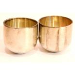 Hallmarked silver pair of tumbler cups, London assay 1975, 122g. P&P Group 1 (£14+VAT for the