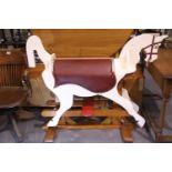 Large wooden rocking horse on pine frame, H: 108 cm, L: 135 cm. Not available for in-house P&P.