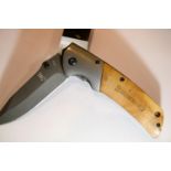 Browning folding Burr walnut handled folding knife. P&P Group 1 (£14+VAT for the first lot and £1+
