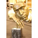 Bronze study of a sleeping head on hand on a marble plinth. P&P Group 3 (£25+VAT for the first lot