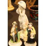 Continental ceramic figurine and two Mottoware figurines. P&P Group 3 (£25+VAT for the first lot and