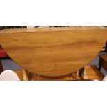 Ercol elm drop leaf dining table, L: 128 cm. Not available for in-house P&P.