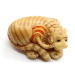 Vintage hand carved tagua nut tiger, signed to base of the tail. P&P Group 1 (£14+VAT for the