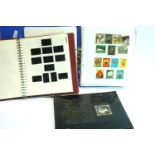 Large binder of worldwide stamps, Isle of Man album with a few stamps and a Stanley Gibbons book