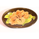 Moorcroft ceramic footed pin dish in the brown Hibiscus pattern, L: 11.5 cm. P&P Group 1 (£14+VAT