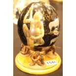Mounted ostrich egg with African decoration, resting on three hunters, H: 22 cm. P&P Group 2 (£18+
