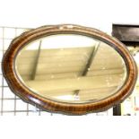 Large oval mahogany framed mirror with bevelled edge glass, 90 x 60 cm. Not available for in-house