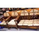 Oak framed 1940s lounge suite comprising two seater settee and two chairs, all with drop backs.