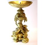 19thC gilt bronze figural table base, having scrolling supports and cherubs, H: 50 cm. Not available