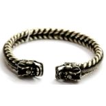 White metal Tibetan silver twisted bangle with dragon head terminals. P&P Group 1 (£14+VAT for the