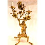 19th century gilt bronze two sconce candelabra, the body in the form of a putti grasping a floral